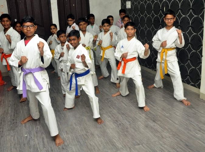 Children practising karate and tae-kwondo