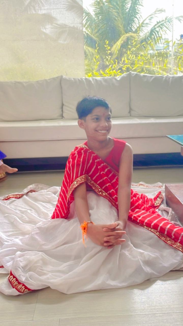 Girl posing in a white and red festive dress