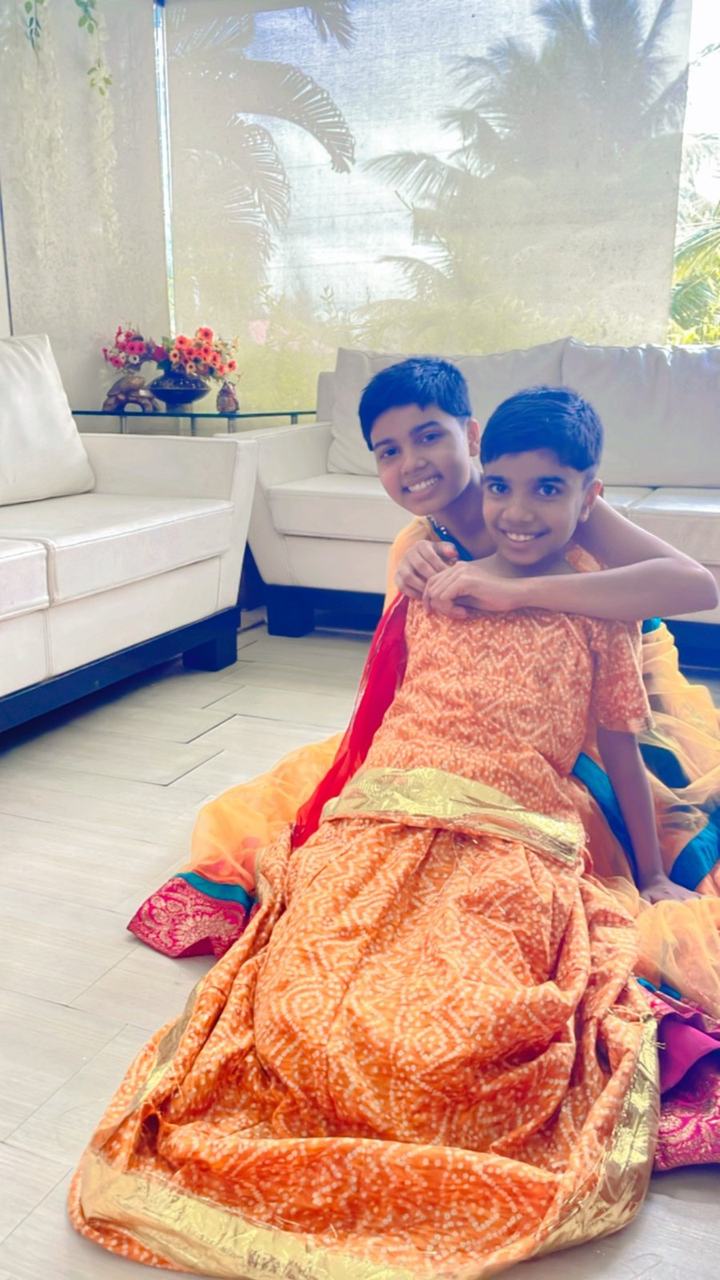 Two boys smiling in festival costumes