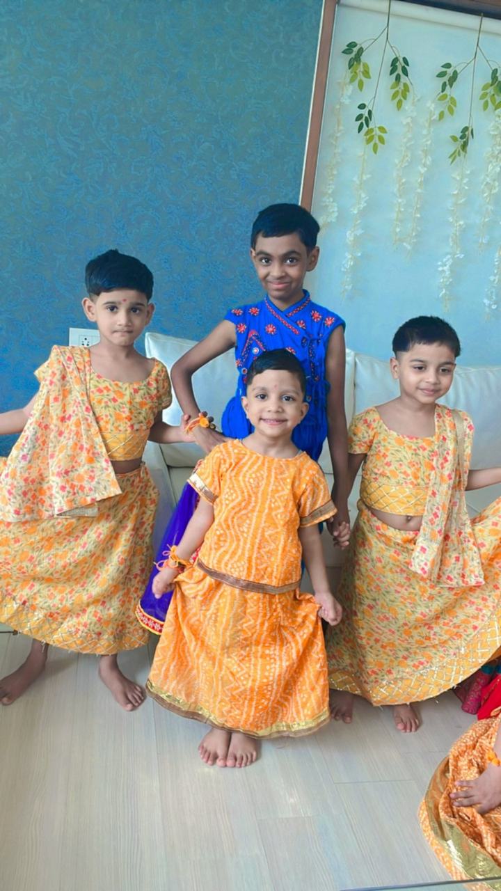 Group of children in orange festival costumes