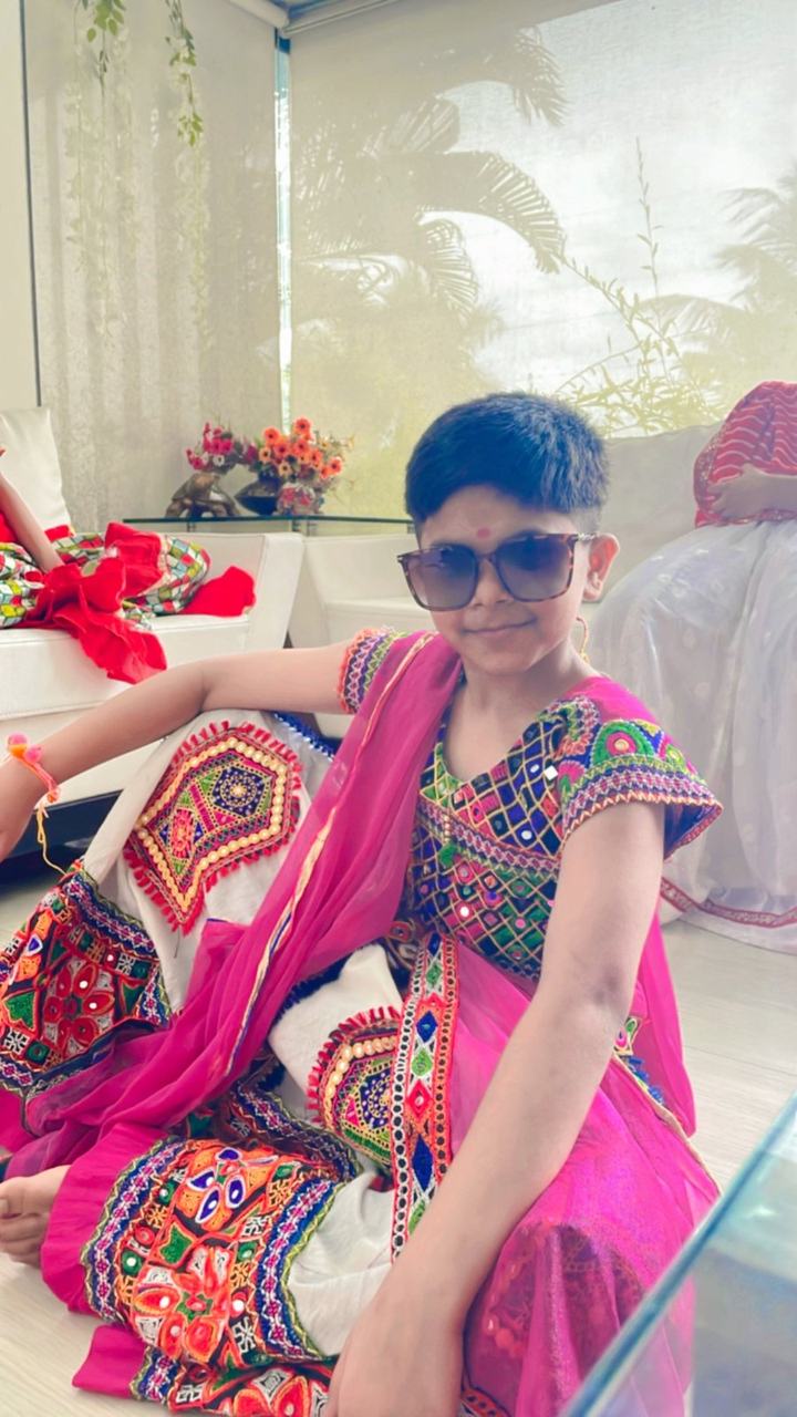 Girl posing in a colourful festive dress