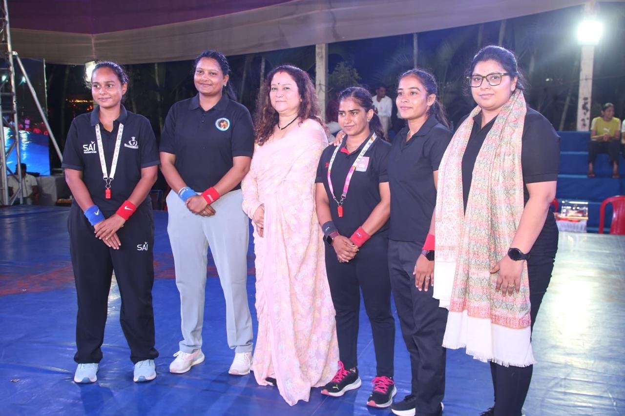 Coaches and mentors at a wrestling championship
