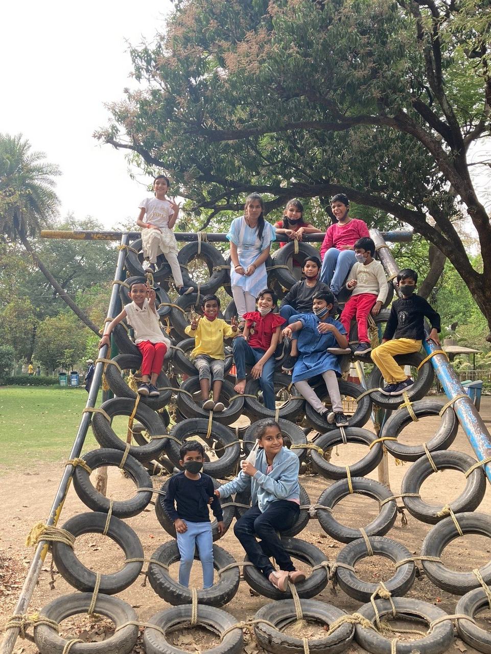 Children on a tyre obstacle course