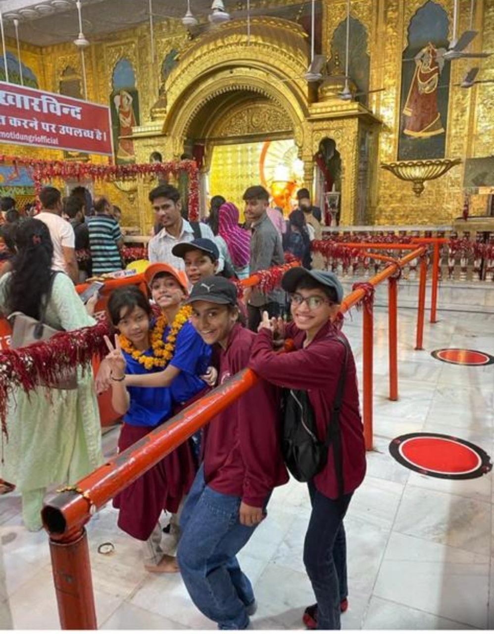 Children visiting a temple corridor
