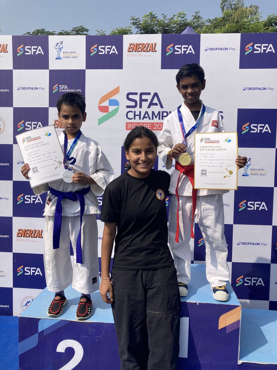 Two girls on the karate championship podium