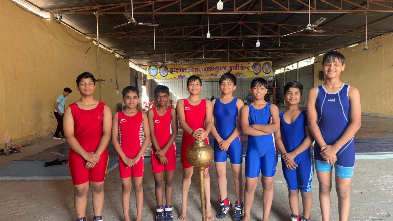 Shiv Karmsthali's wrestling squad lined up in the practice hall