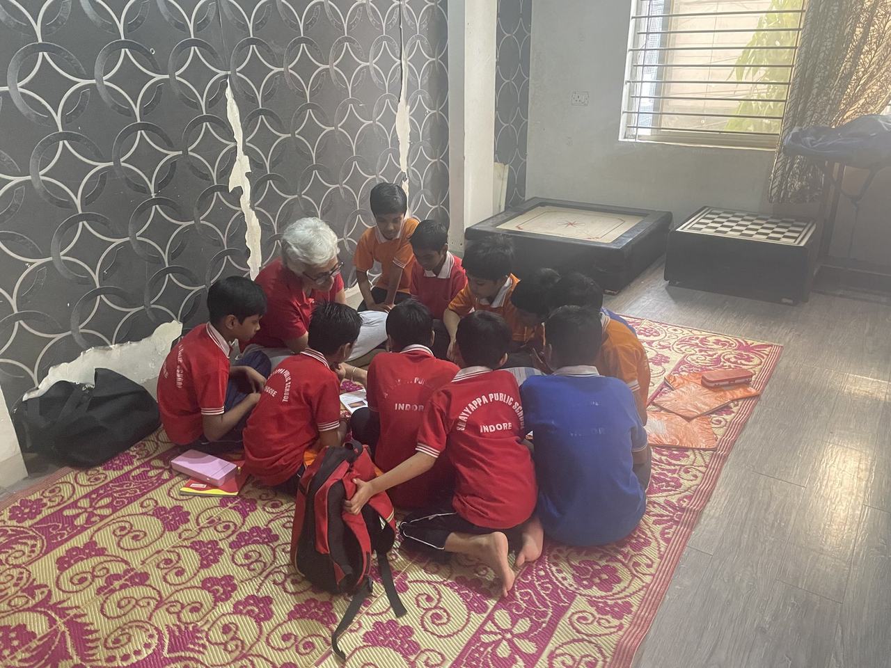 Children studying together on the floor