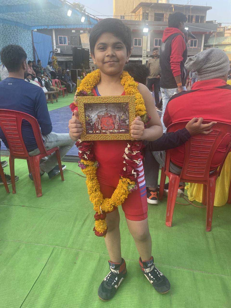 Child receiving recognition at an achievement ceremony