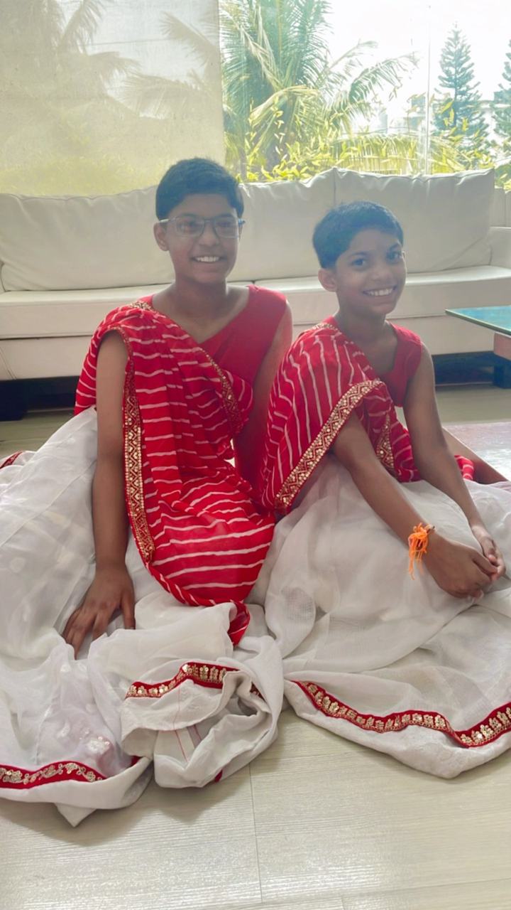 Two girls in red and white festival dance costumes