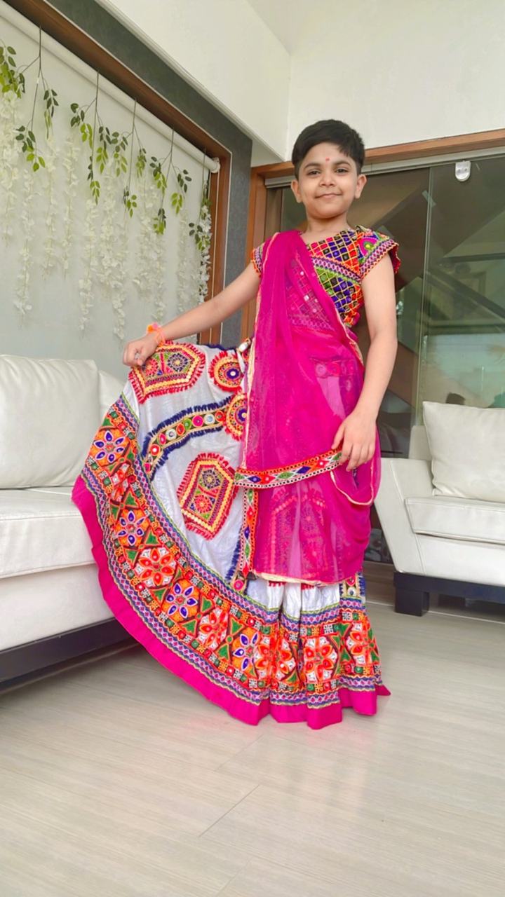 Girl posing in a pink festive lehenga