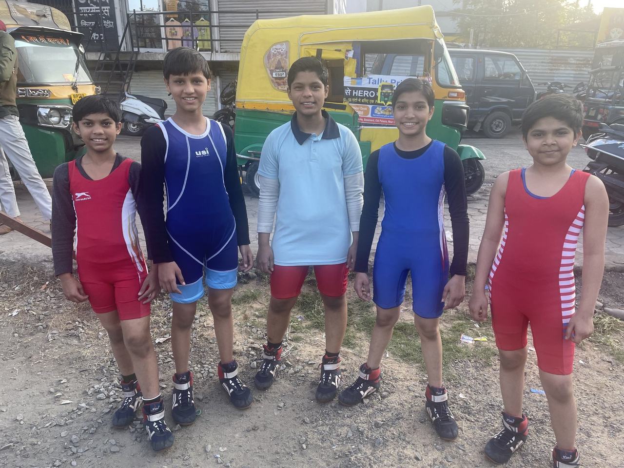 Wrestling team posing outdoors